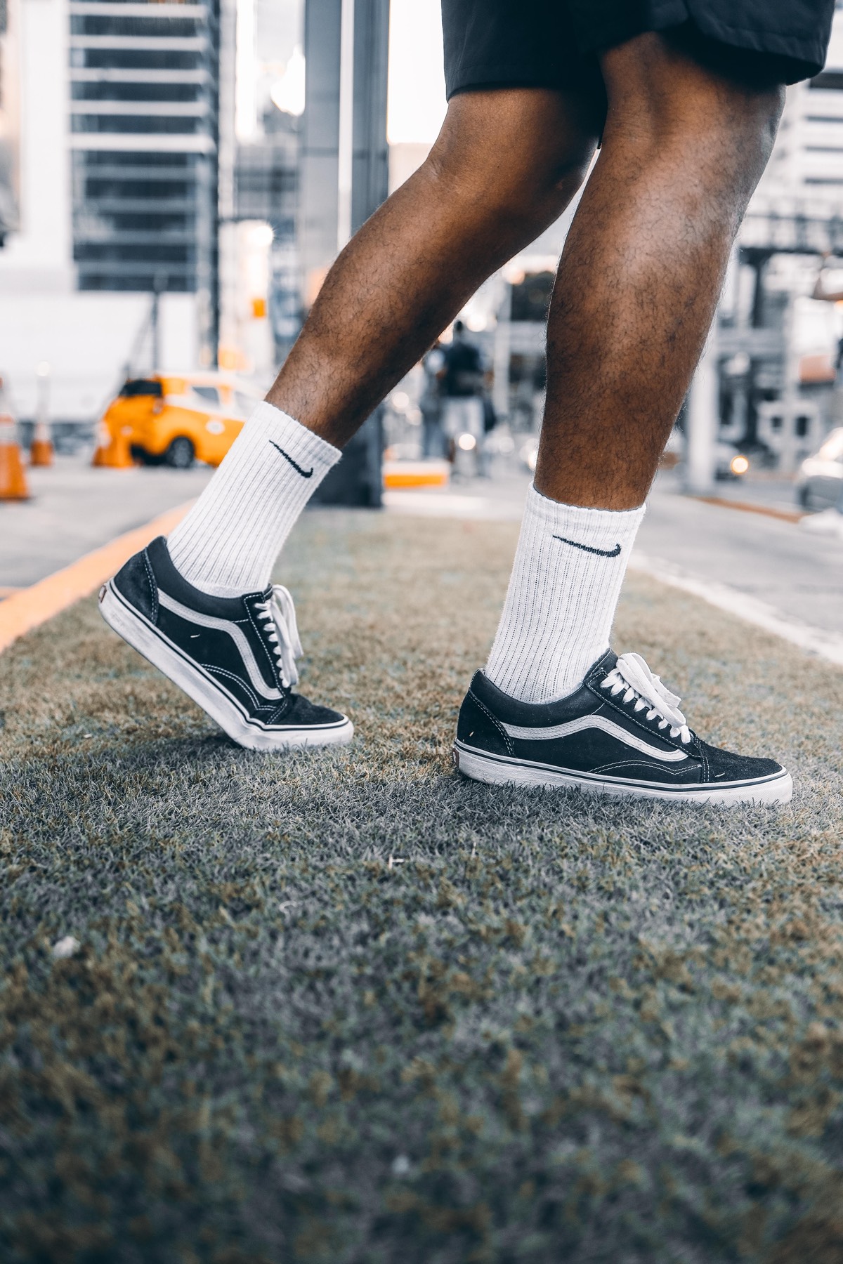 Runner in white crew socks and sneakers on the street